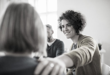 three people talking