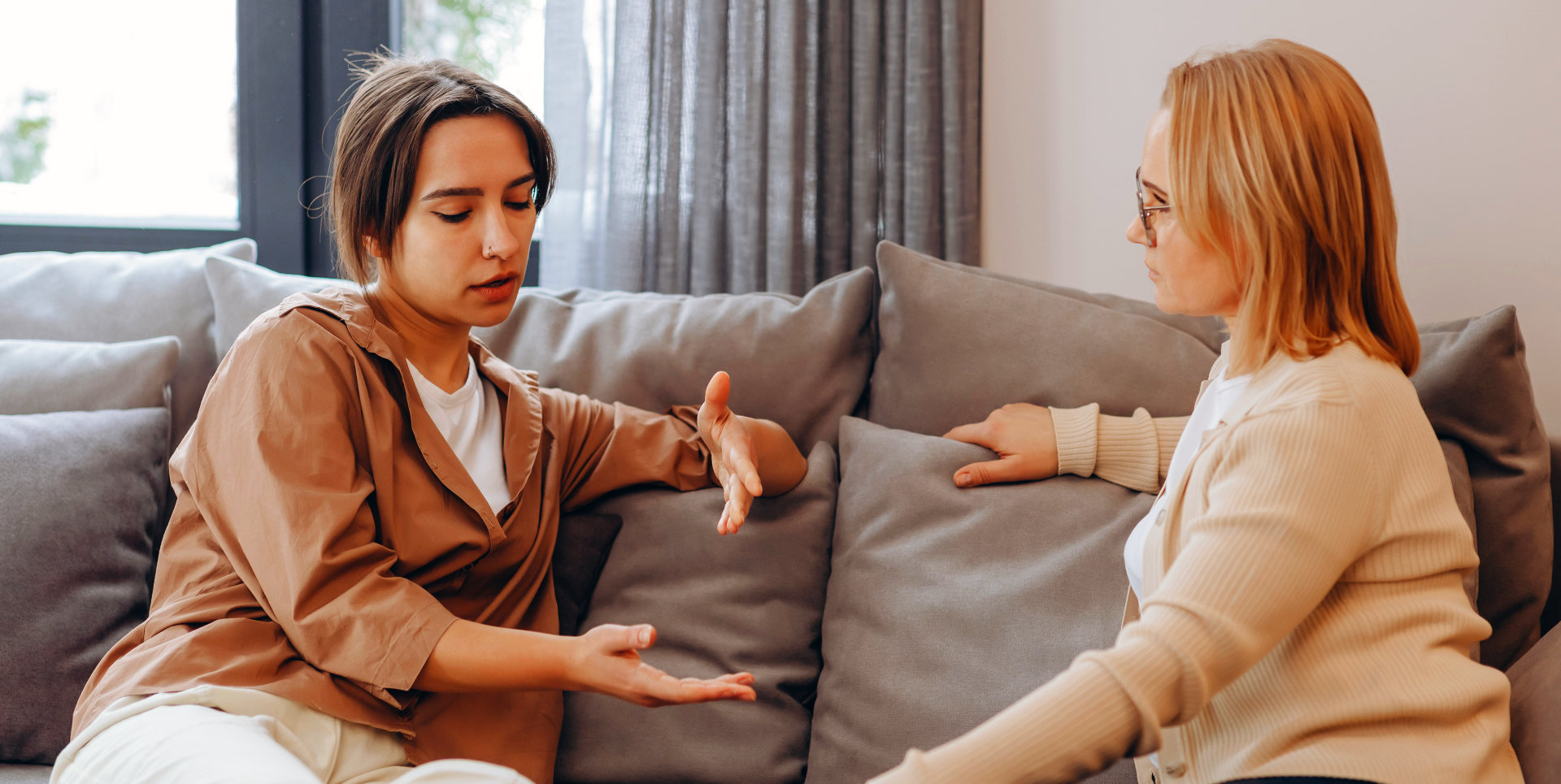 two adult ladies talking