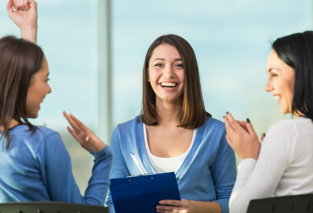 three people talking